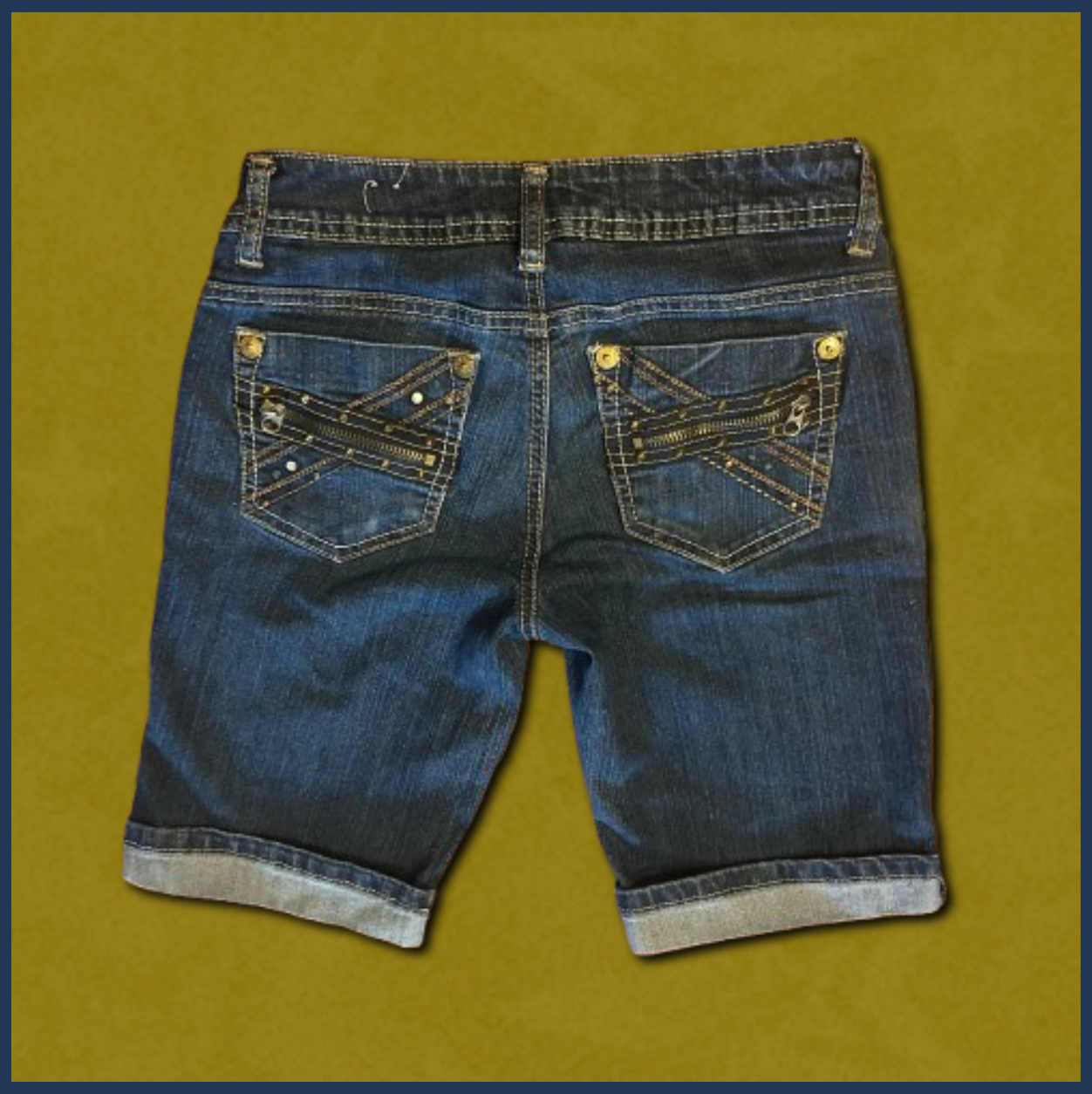 dark wash jean shorts with gold zipper design