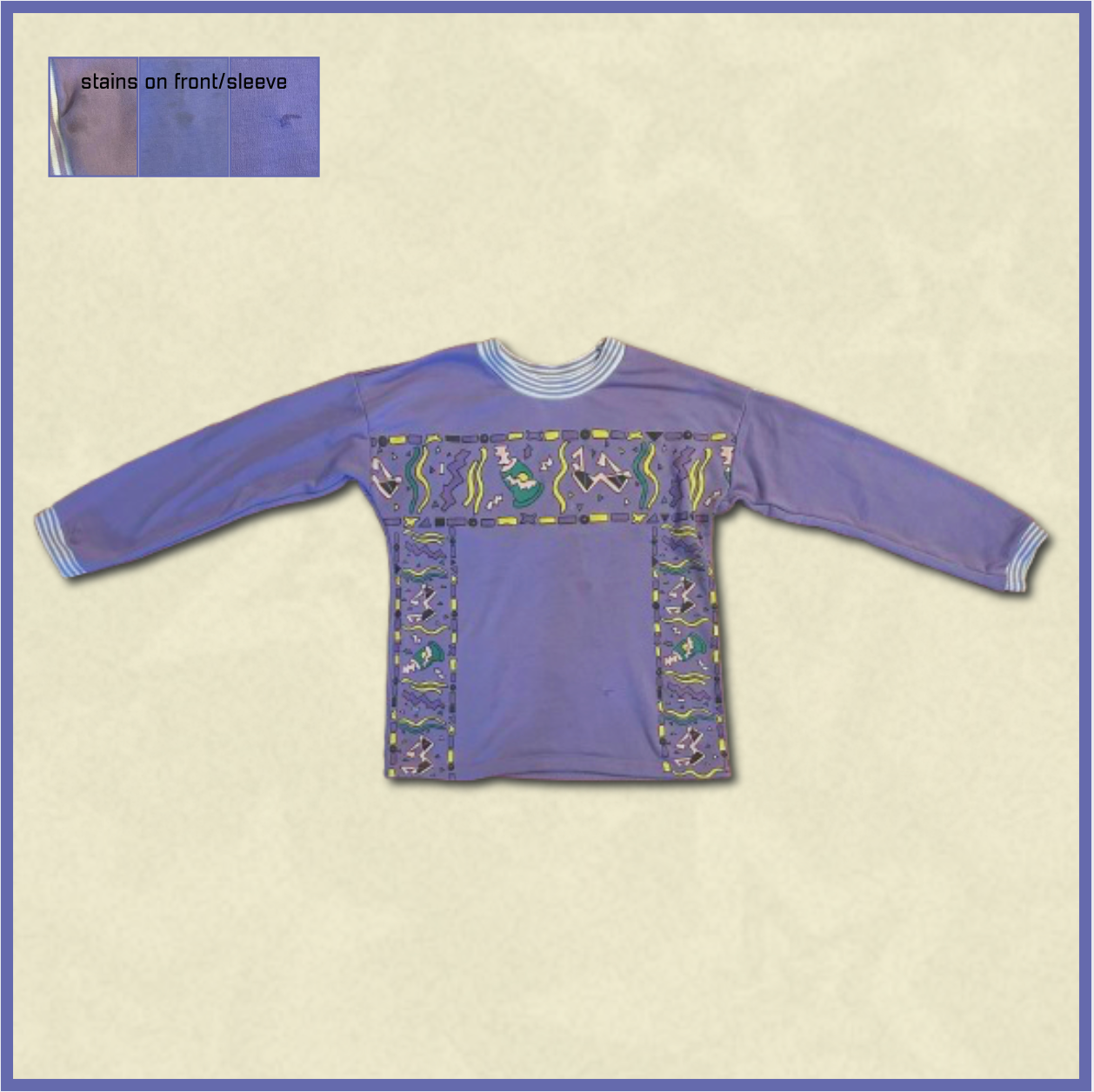 purple sweater with multicolored design