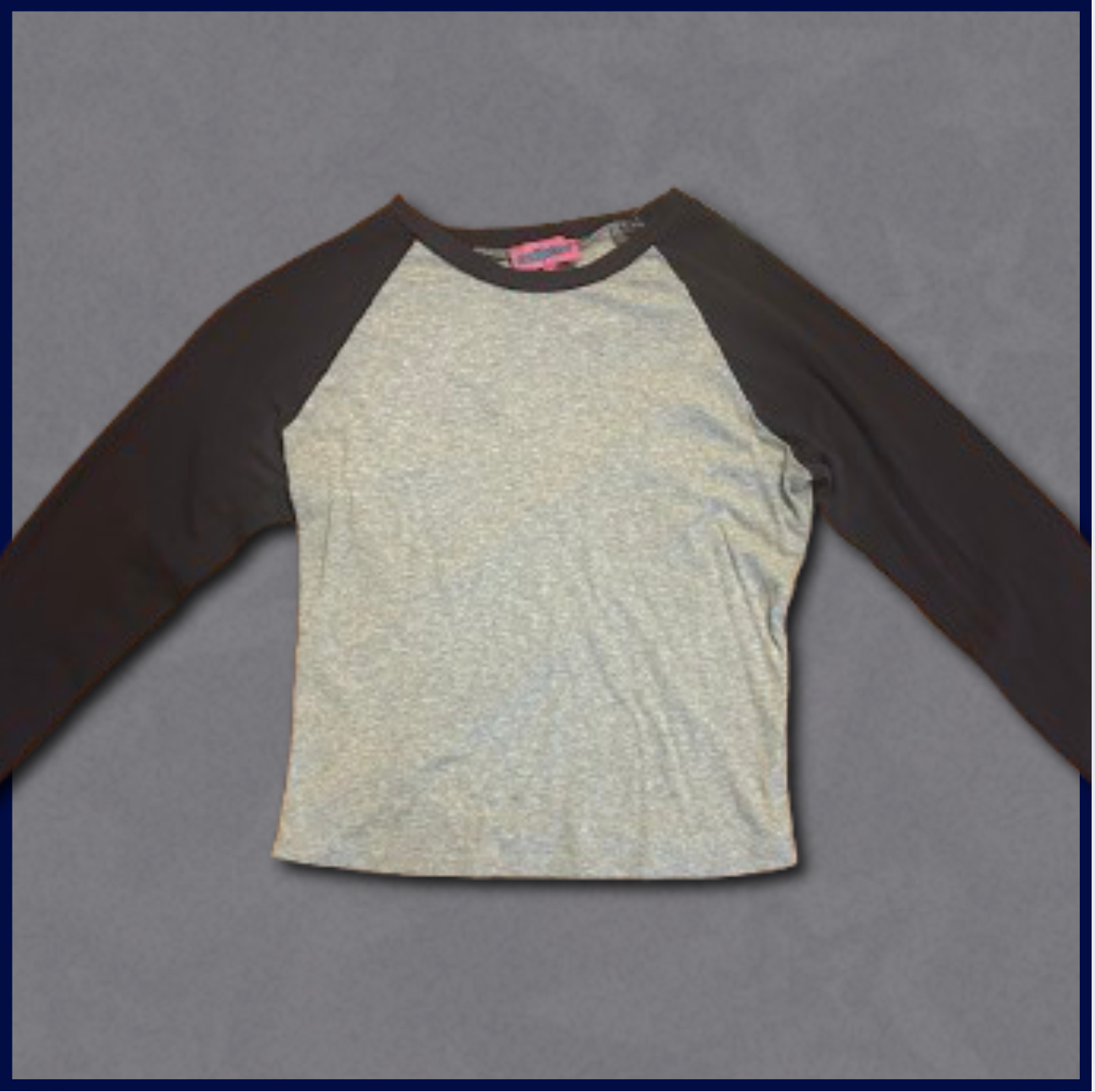gray slim-fitting top with dark navy sleeves