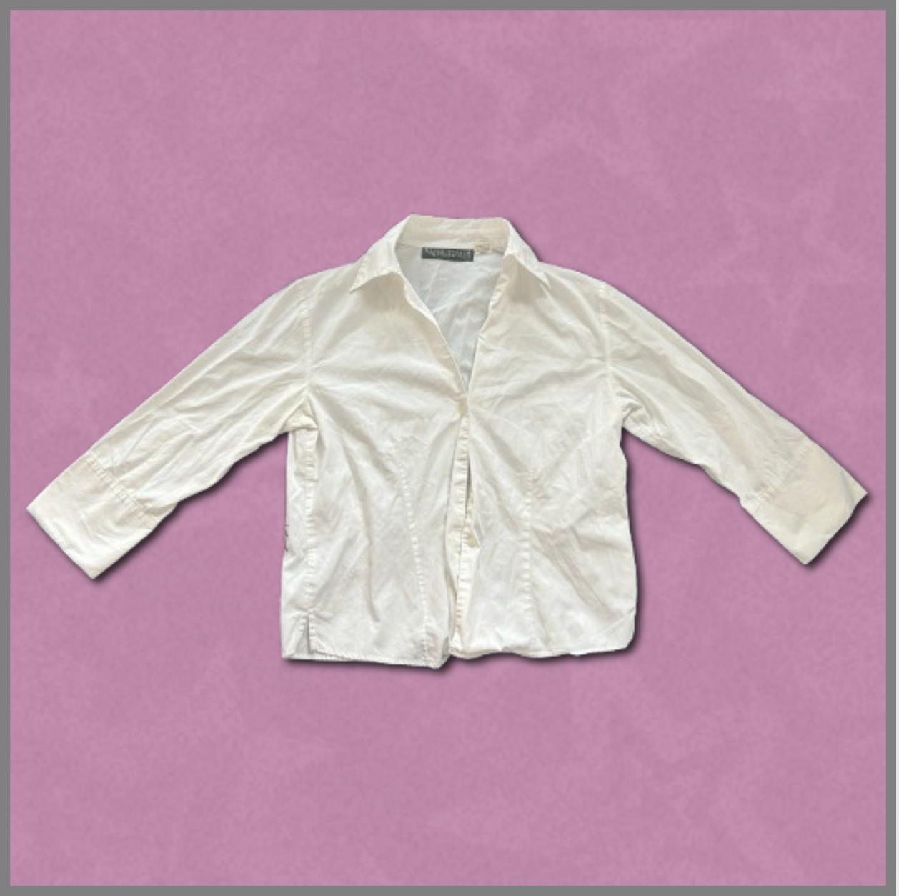 white button-up long-sleeve top