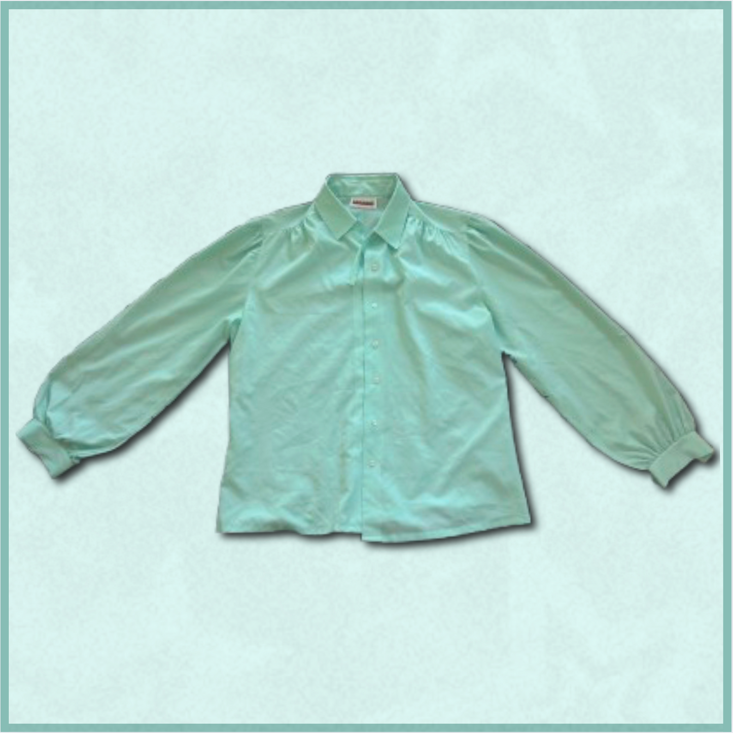 bright turquoise button-up top