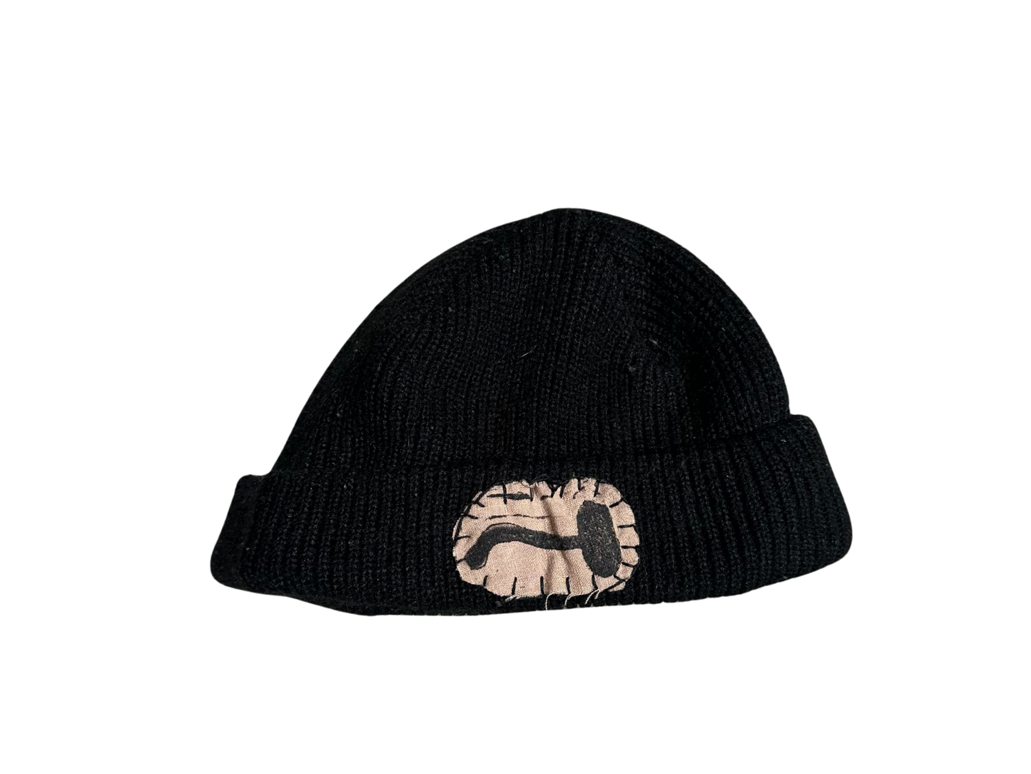 black beanie with tan mushroom patch