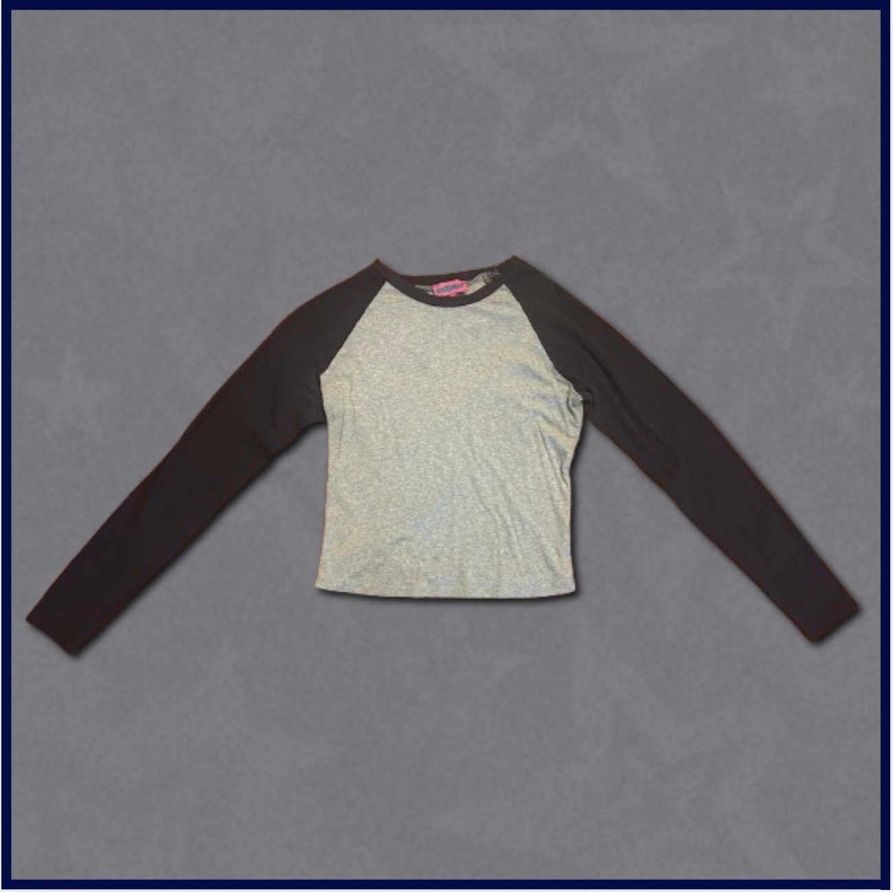 gray slim-fitting top with dark navy sleeves
