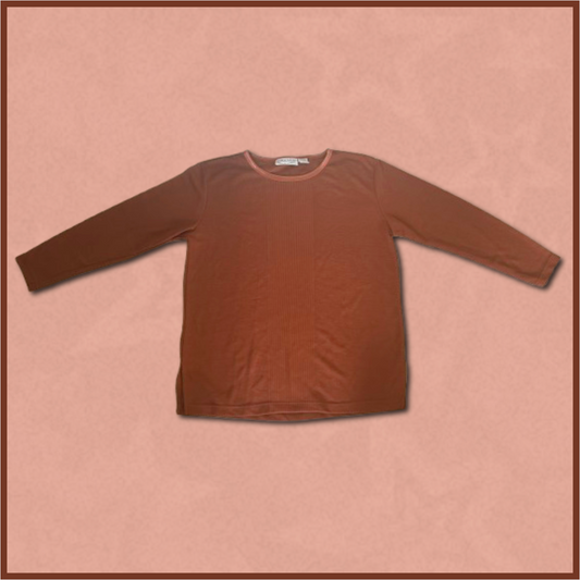 dark brownish-orange loose-fitting long-sleeve top