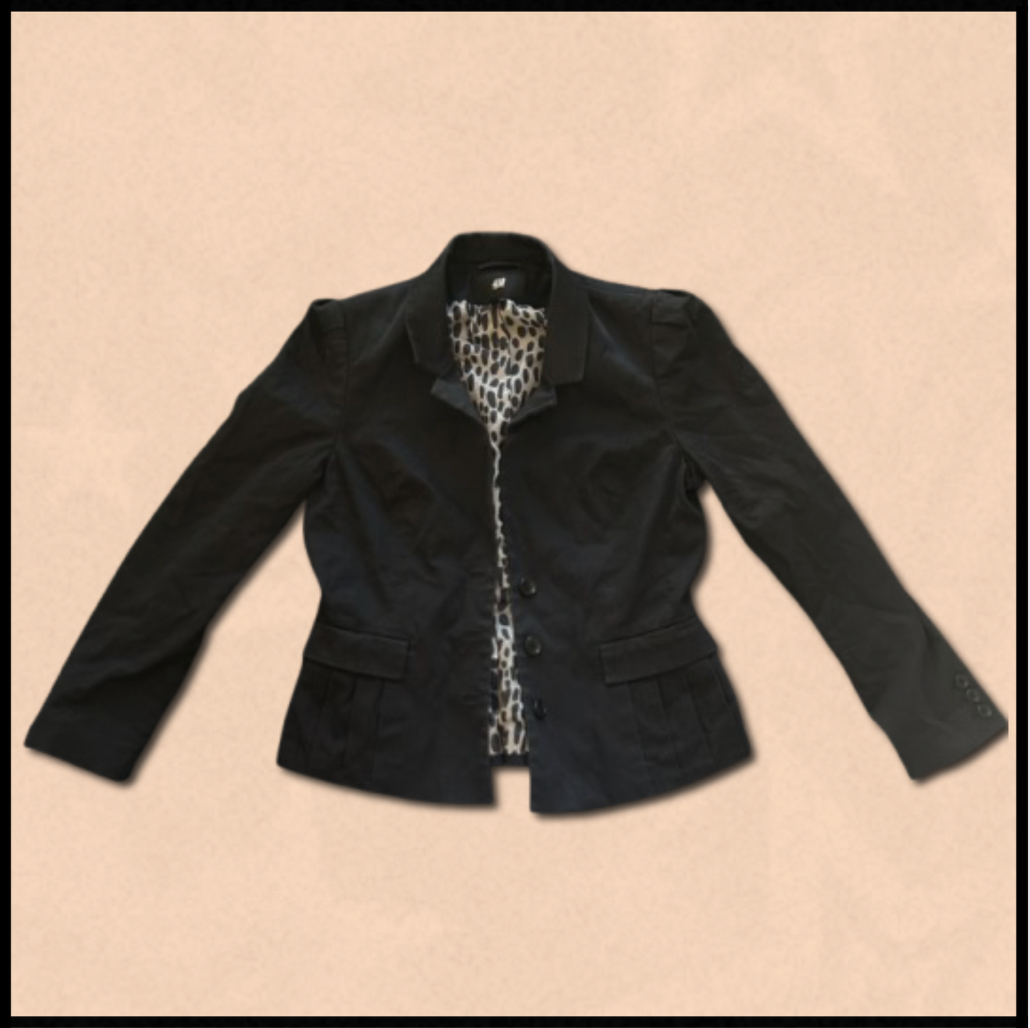 black blazer with beige/black internal design
