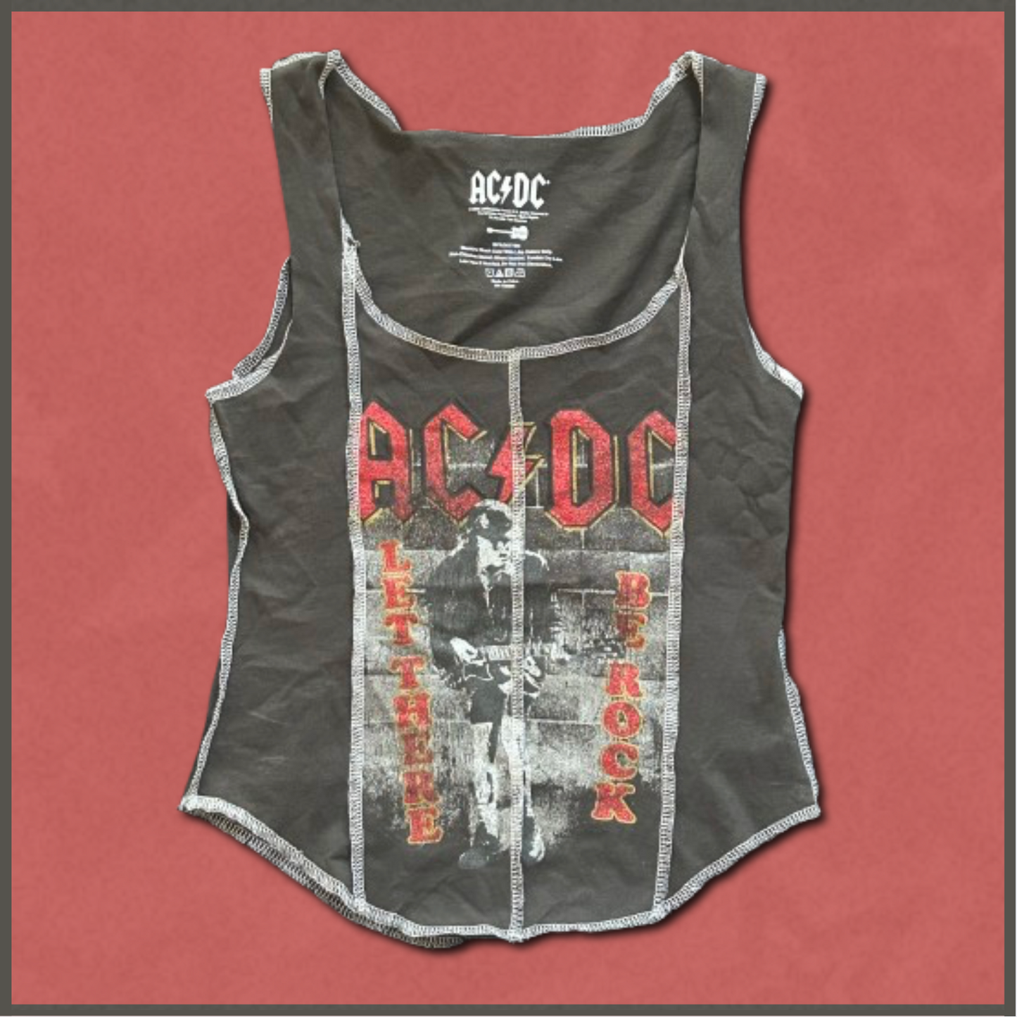 gray + red/white "ACDC" top