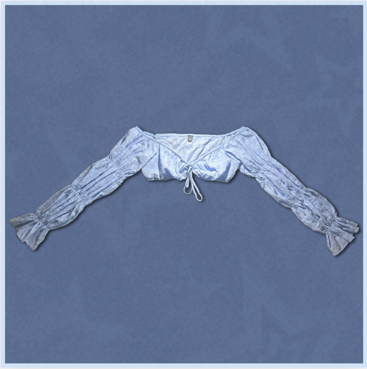 light blue off-shoulder long-sleeve top