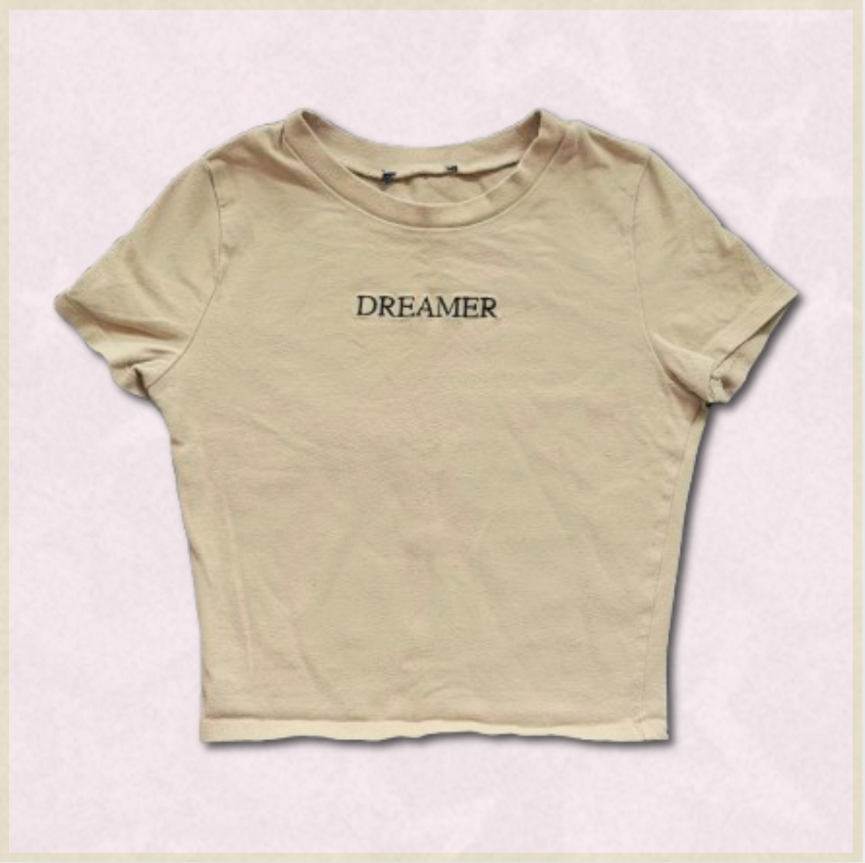 beige "DREAMER" cropped top