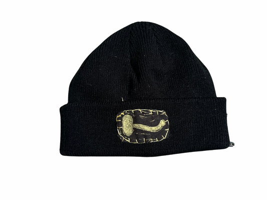 black beanie with gold mushroom patch